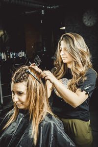 Young woman with arms raised