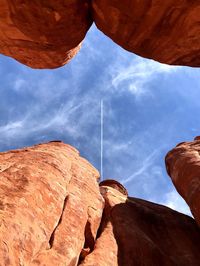 Low angle view of rocks against sky