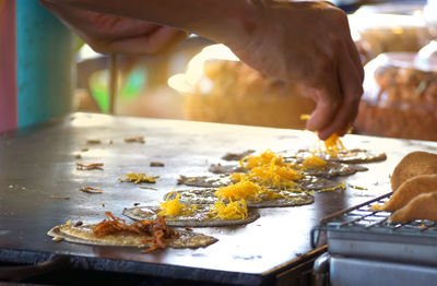 Close-up of person preparing food