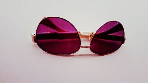 Close-up of sunglasses against white background