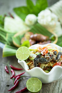 Close-up of fruits in plate on table