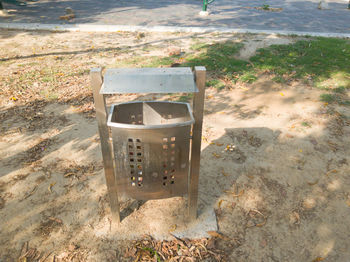 High angle view of empty chair on beach