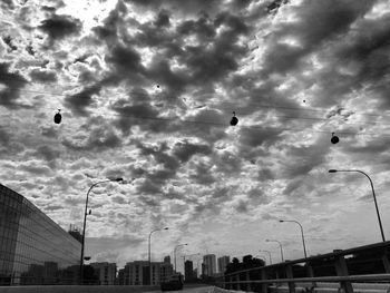 Low angle view of building against cloudy sky