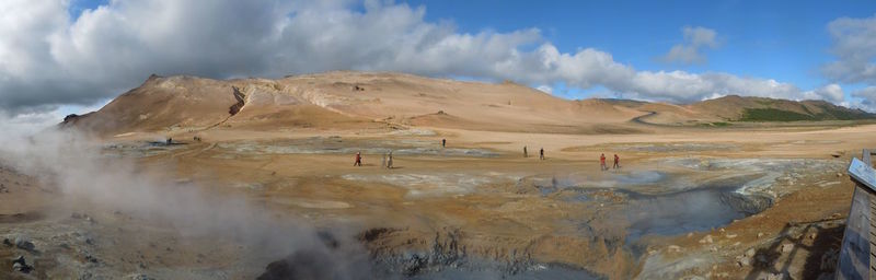 Panoramic view of arid landscape against sky