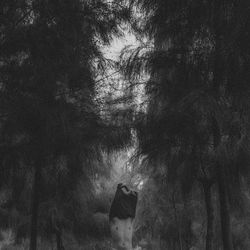 Woman walking in forest