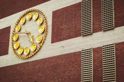 Low angle view of clock on building