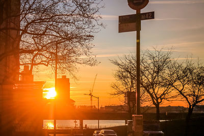 Low angle view of street light against sky during sunset