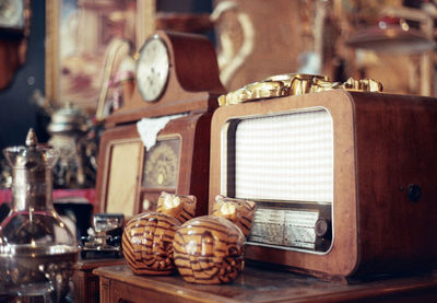 Close-up of old objects on table at store