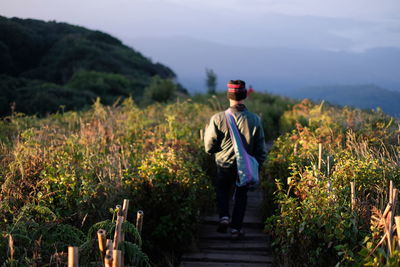 Full length of young man standing on land