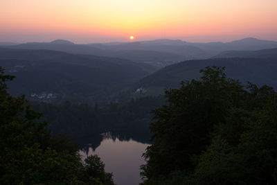 Scenic view of mountains against sky during sunset