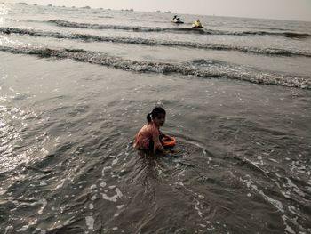 Girl swimming in sea