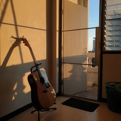 Close-up of guitar on table at home