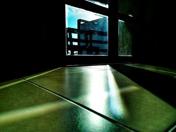 Empty table by window in building