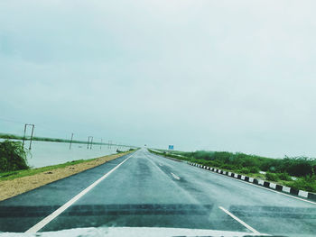 Road seen through car windshield