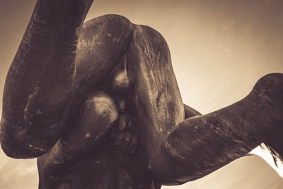 Close-up of statue of man holding sculpture