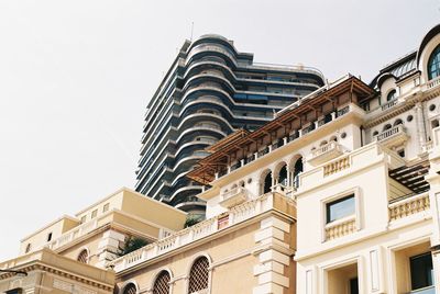 Low angle view of buildings against clear sky