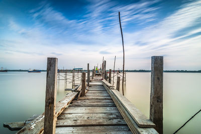 Wooden jetty leading to lake