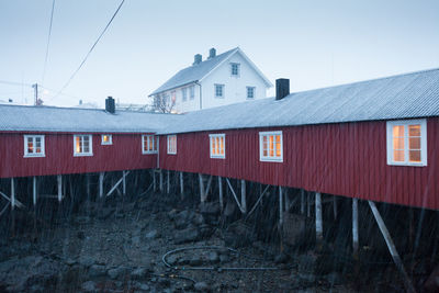 View of old houses in village against sky