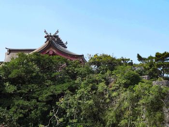 Low angle view of traditional building against blue sky