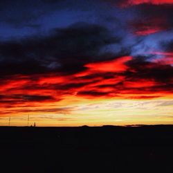 Silhouette of landscape against dramatic sky