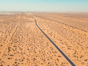 Scenic view of desert against sky during sunset