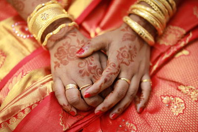 Low section of woman with henna tattoo