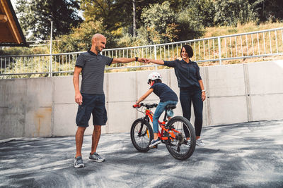 Rear view of man riding bicycle