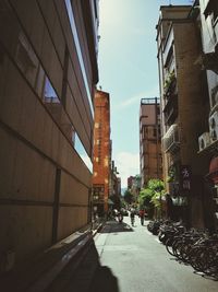 Alley amidst buildings in city