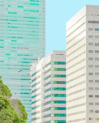 Low angle view of modern buildings against clear sky