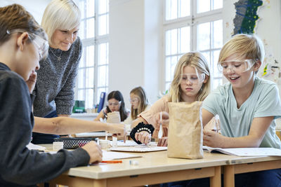 Children with teacher in classroom