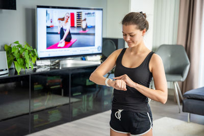 Young woman exercising in gym