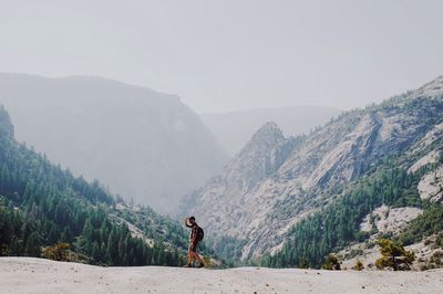 Woman standing on mountain