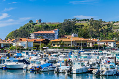 Boats moored at harbor