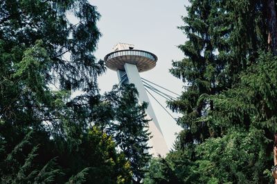 Low angle view of communications tower against sky