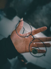 Close-up of hand holding glass