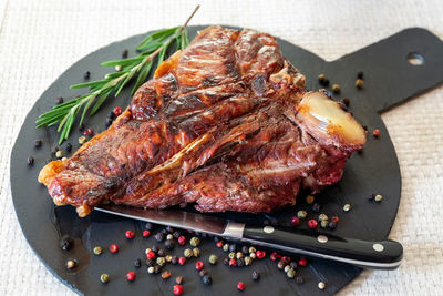 High angle view of meat on barbecue grill