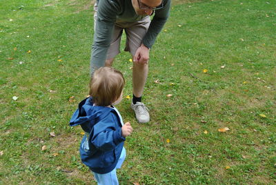 Father and son on field