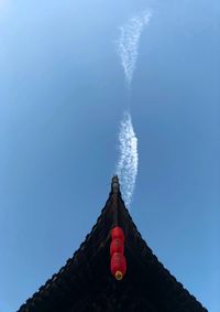 Low angle view of building against blue sky