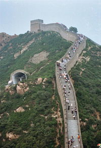 People at great wall of china on mountain