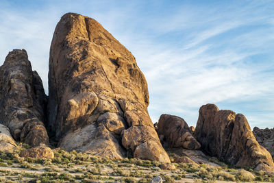 Low angle view of rock formation against sky