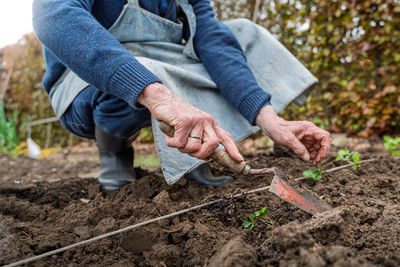 Midsection of man gardening
