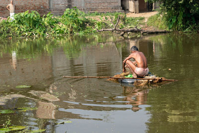 Man sitting in lake