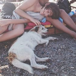 Woman with dog lying down