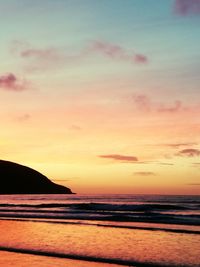 Scenic view of sea against sky at sunset