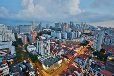 High angle view of cityscape against cloudy sky