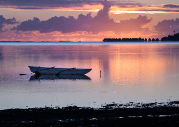 Scenic view of lake against sky during sunset