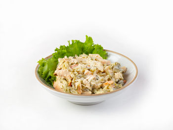 Close-up of food served in bowl against white background