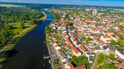 High angle view of river by houses in town