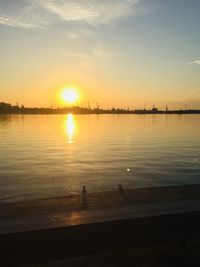 Scenic view of lake against sky during sunset