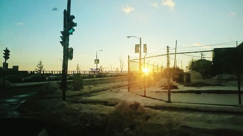 Street light against sky at sunset